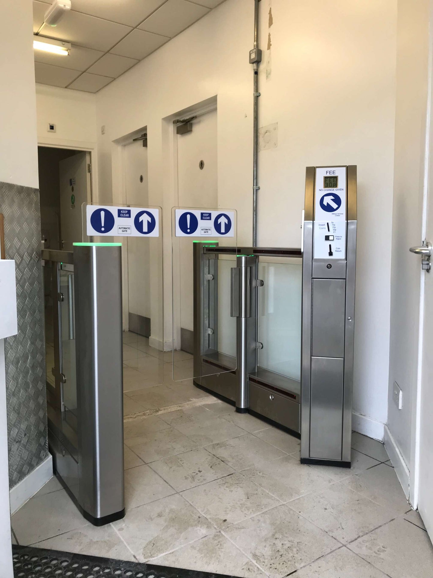 Evolve PG150 coin operated speed gate in a public facility entrance.