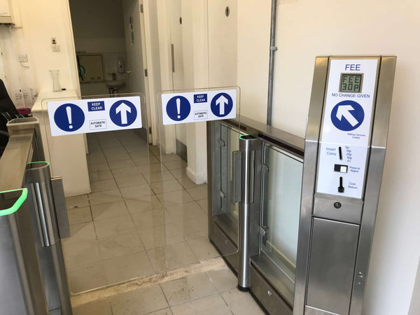 Coin Operated Turnstiles & Speed Gates installed in a facility with clear signage and a payment system.