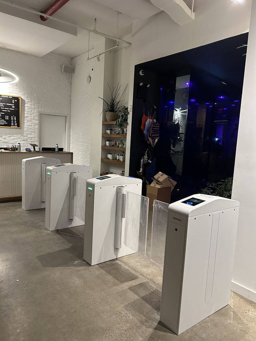 CT200 Compact Speed Gate installation in a modern gym environment, showcasing multiple access control units.